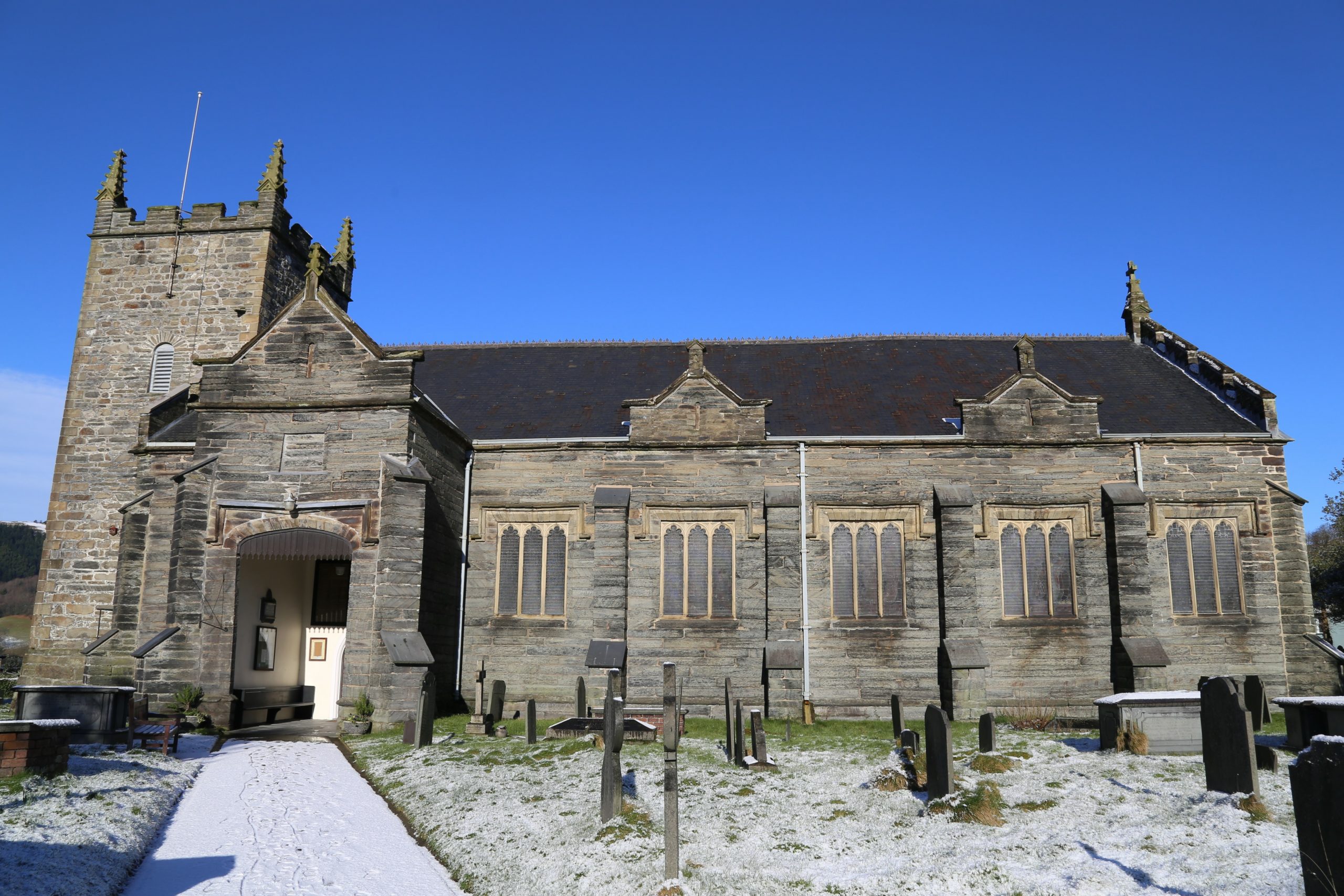 The front entrance and graveyard of St. Peter's Church in Machyn